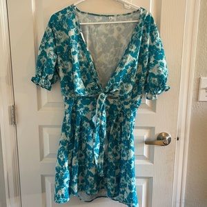 NWOT teal mini dress with small front cut out.
